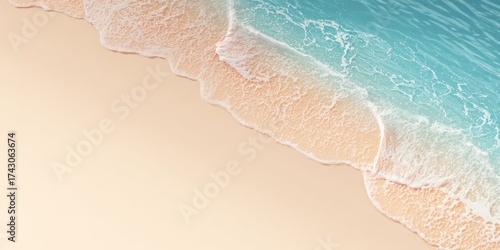 Aerial view of a sandy beach meeting crystal clear turquoise ocean water with foamy waves