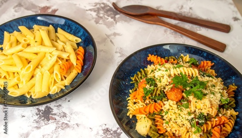 Fototapeta Naklejka Na Ścianę i Meble -  Pasta meal on blue plates