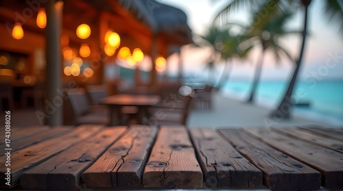 Serene beachside restaurant setting at sunset with warm lights and ocean view, perfect for tranquil dining experiences.