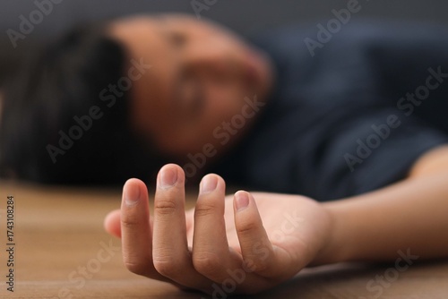 Valokuva Closeup Hand of Child Unconscious on the Floor