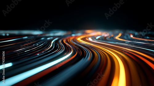 Abstract light trails of vibrant orange and blue streaks on a dark background creating a sense of speed and motion