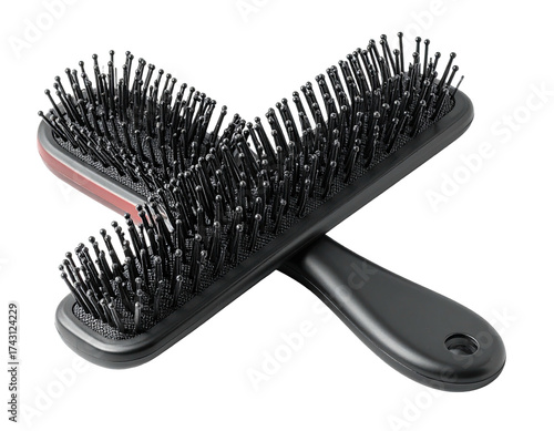 Two black hairbrushes are crossed, showcasing bristles and ergonomic handles
