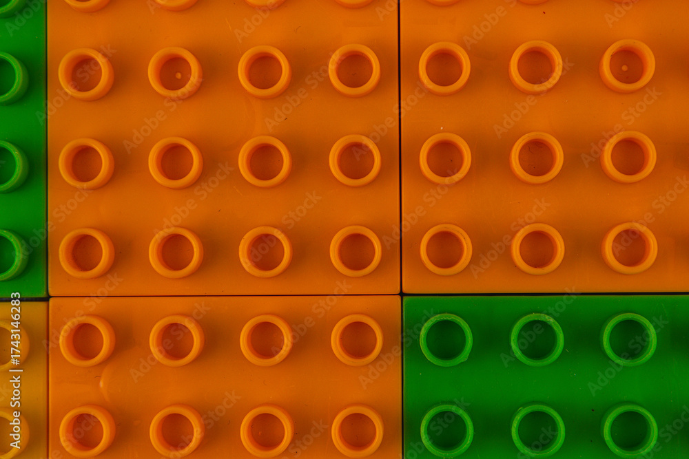 Fototapeta premium Colorful building blocks arranged in a playful pattern on a surface