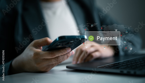 Businesswoman holding smartphone and laptop with digital payment and global map icons. Secure mobile payment, online banking, digital finance and international e-commerce transactions.