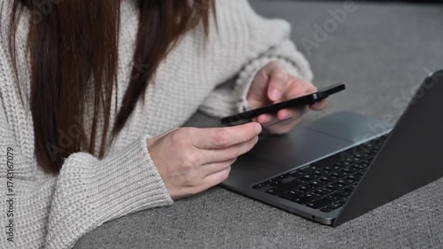 Beautiful young woman using laptop, shopping online at home