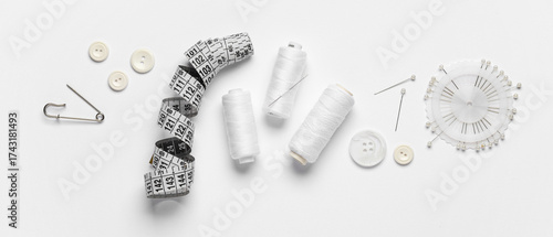 Sewing supplies on white ba...