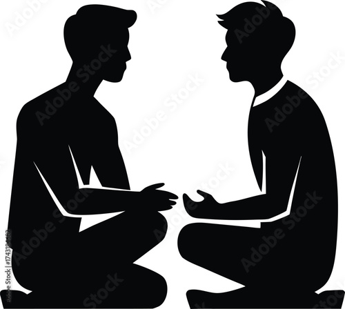 Two men sitting facing each other in silhouette