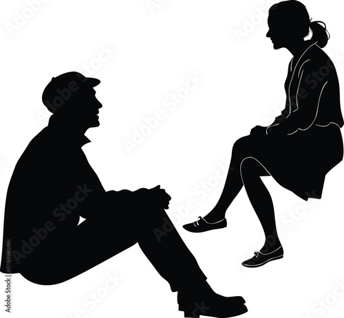 Man and woman sitting in conversation silhouette