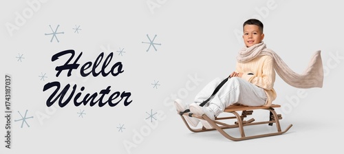 Little Asian boy in warm cl...