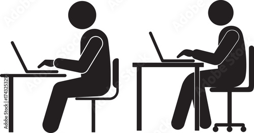 Two people working on laptops at desks silhouette