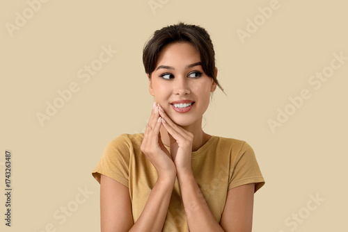 Dreaming young woman on bei...