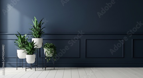 Modern interior with potted plants against a dark blue wall with wainscoting