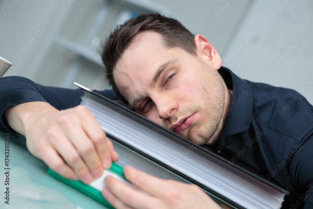 Fototapeta premium tired businessman sleeping in office