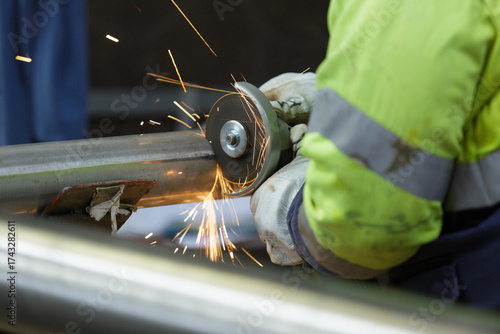 hot sparks flying in the air from a metal grinder