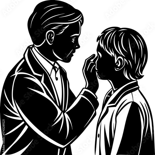 Doctor examining childs eye in silhouette examination