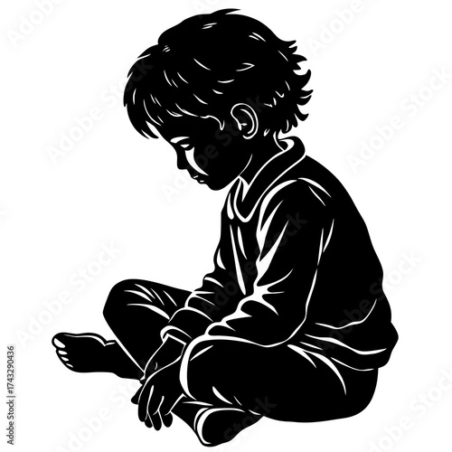 Black silhouette of a young boy sitting cross-legged