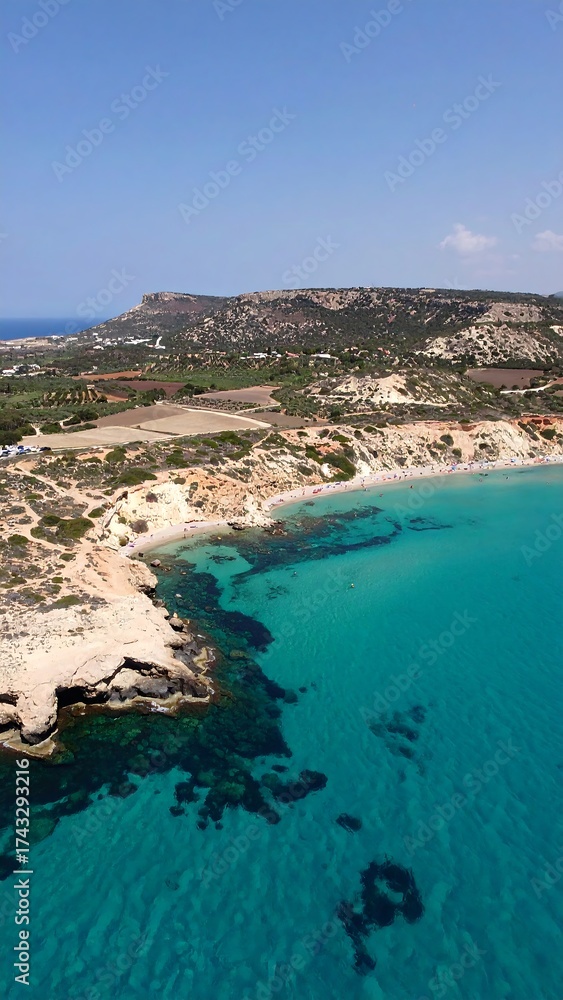 Fototapeta premium Turquoise bay with rocky cliffs and green hillside