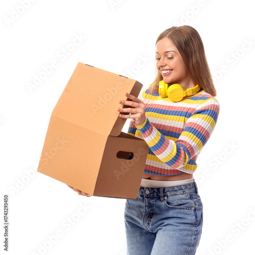 Young woman opening cardboa...