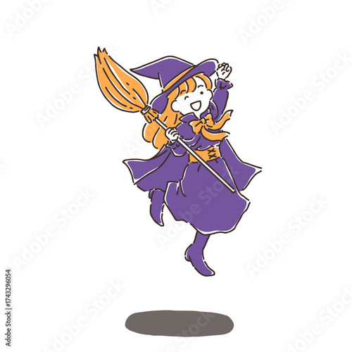 ジャンプしている魔女の仮装でほうきを持っている若い女性