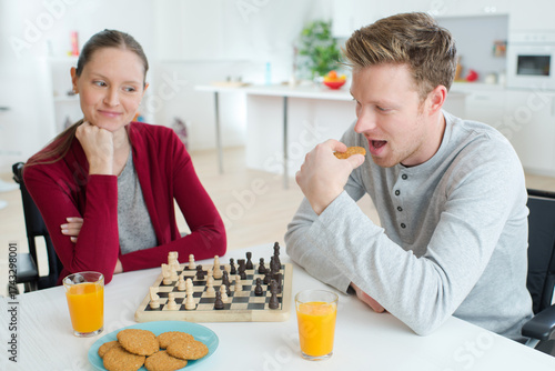 young couple having breakfast at home