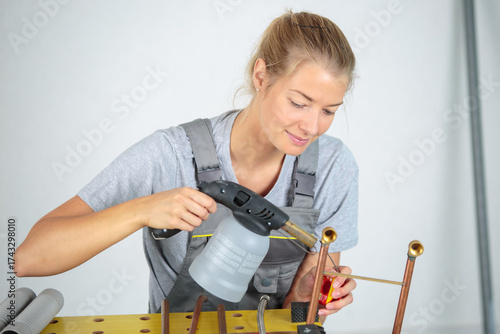 Wallpaper Mural woman uses a torch with cooper Torontodigital.ca