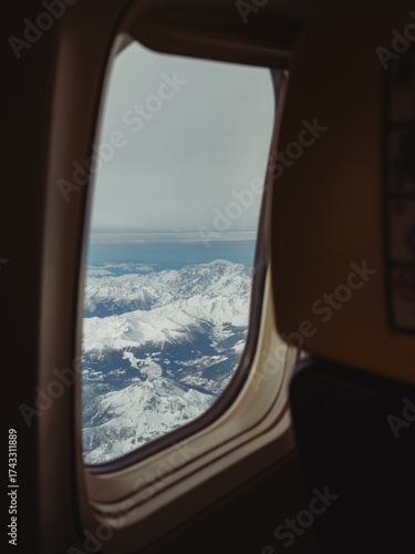 Canvas Print Looking Through an Airplane Window at the Swiss Alps