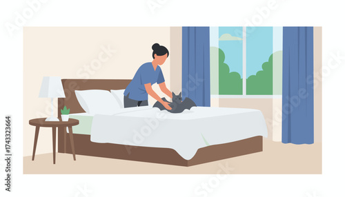 Woman placing bat on bed in a bright bedroom depicting unique pet care or animal interaction