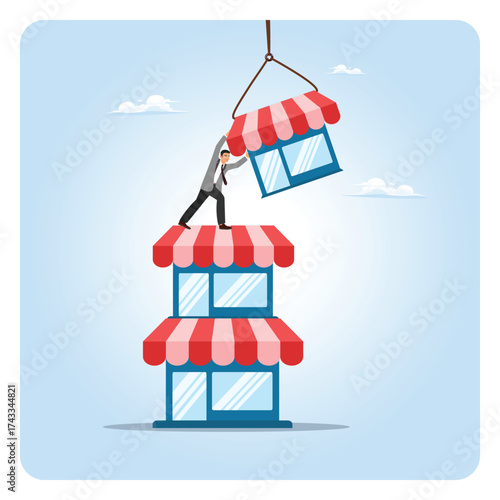 Build up business concept, ambitious businessman build up store on top of company stack.
