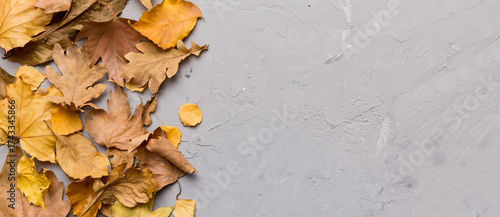 Autumn composition. Pattern made of dried leaves and other design accessories on table. Flat lay, top view