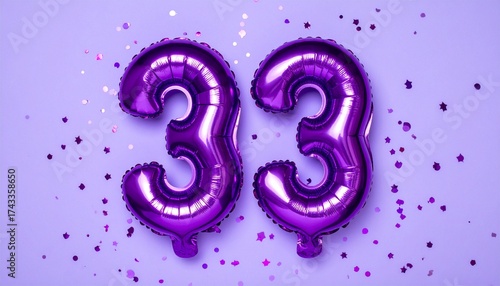 Purple balloon number 33 with confetti on solid colored background. Photo for anniversary or birthday party