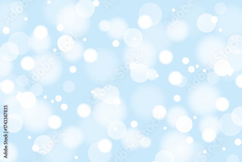 Bokeh light effect on blue background. White shining circles, flare sparkles or snowflakes