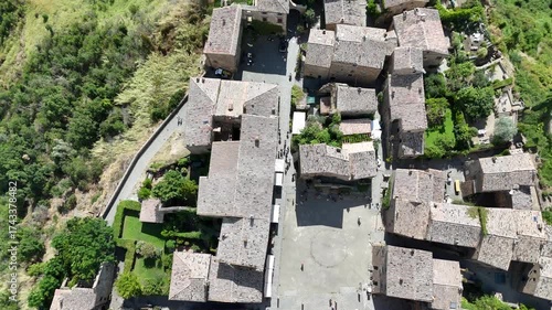 Aerial drone footage of Civita di Bagnoregio, the famous ‘dying town’ in Lazio, perched on a hilltop with dramatic surrounding valleys.