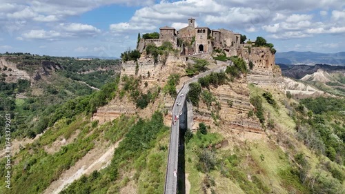 Aerial drone footage of Civita di Bagnoregio, the famous ‘dying town’ in Lazio, perched on a hilltop with dramatic surrounding valleys.