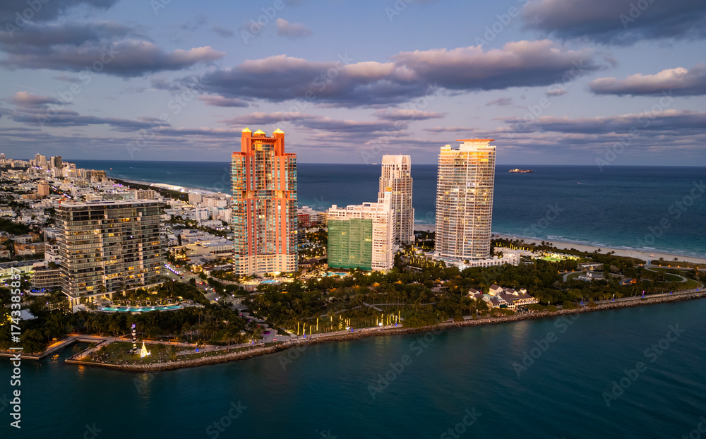 Obraz premium Top view of South Miami Beach and the ocean. Miami skyline with skyscrapers. Aerial view of Miami in summer. Miami shore with luxury buildings.