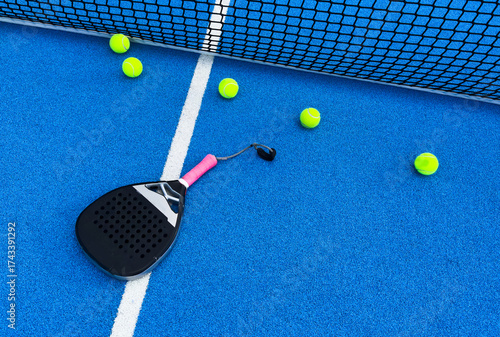 padel racket on a padel blue court 