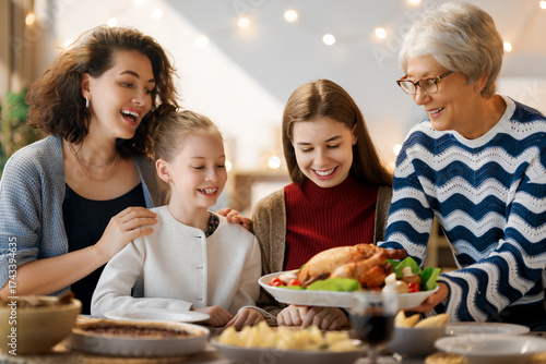 Family celebrating Thanksgiving Day