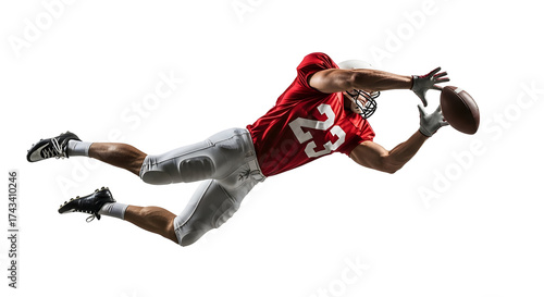 American football player diving to catch a football.