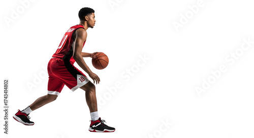 Young basketball player dribbling the ball with focus and determination.