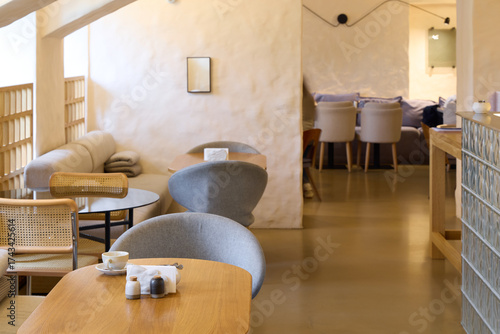 The modern cafe interior has a sleek design that creates a cozy and inviting atmosphere