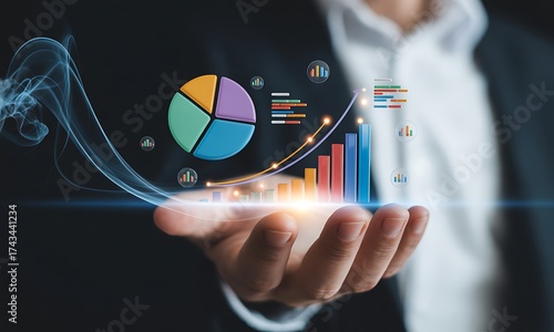 Businessman holding holographic pie chart and bar graph with rising trend line, ideal for illustrating analytics, data growth, and financial performance concepts