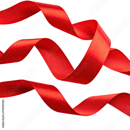 Three vibrant red ribbons curl and twist against a stark black background
