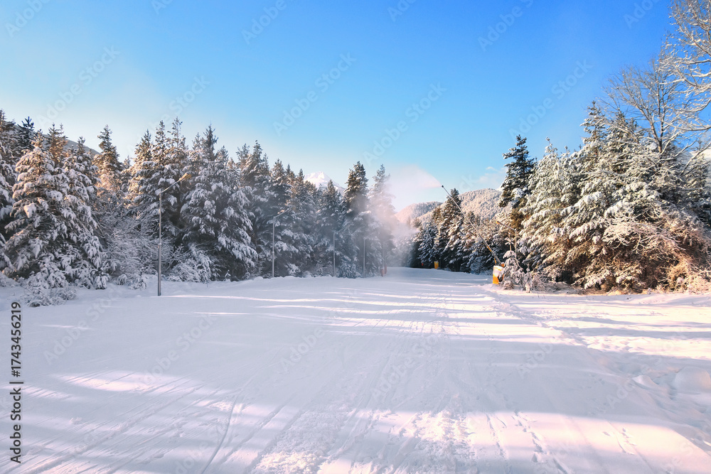 Obraz premium Bansko ski slope and snow peaks, Bulgaria