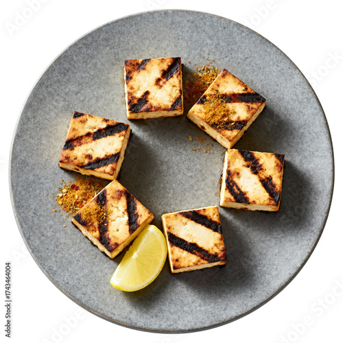 Gourmet Grilled Paneer Tikka Appetizer with Spices and Lemon Wedge