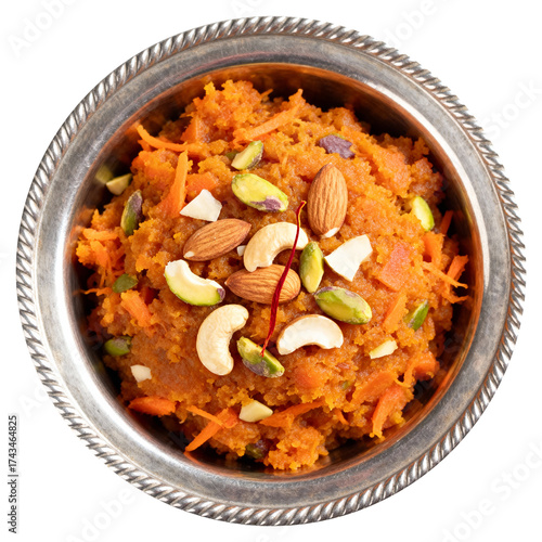 Traditional Indian Gajar ka Halwa, a carrot dessert pudding in a silver bowl