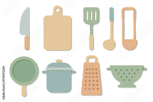 Kitchen tools arrangement featuring essential utensils and cookware on white background