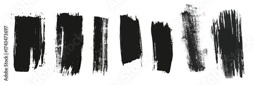 Set of black grunge paint brush strokes and distressed vertical stripes isolated on white background in minimalist vector style for design elements and backgrounds