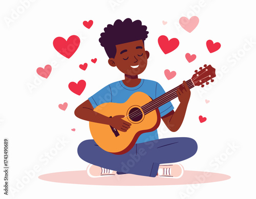 Young man playing guitar while sitting cross-legged, surrounded by floating hearts.