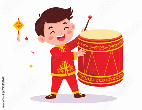 A cheerful boy in traditional red clothing plays a large red drum during a celebration.