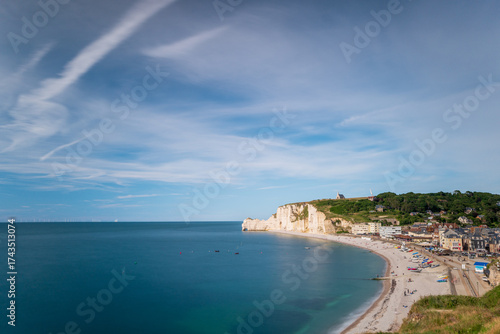 The beach of Etretat with the Amont Cliffs, natural rock arch of the alabaster coast, department of Seine Maritime, Normandie region, France.