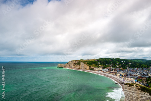 The bay of Etretat with the Amont Cliffs and its pebble beach, department of Seine Maritime, Normandie region, France.